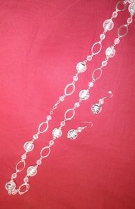 Long silver necklace with glass beads